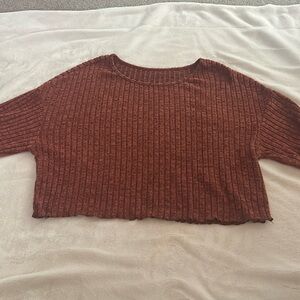 Loose fitting dark orange sweater top